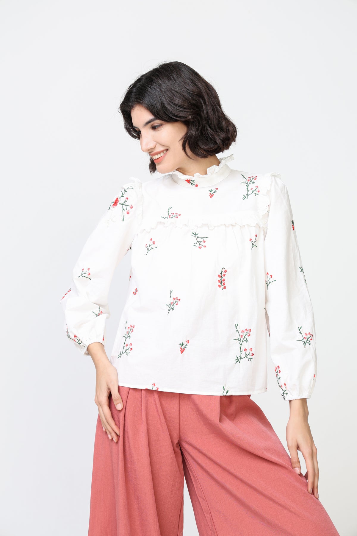 Embroidered ruffle neck blouse